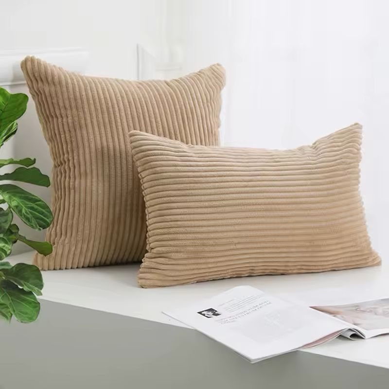 Brown velvet cushion cover adding warmth to a cozy living room.