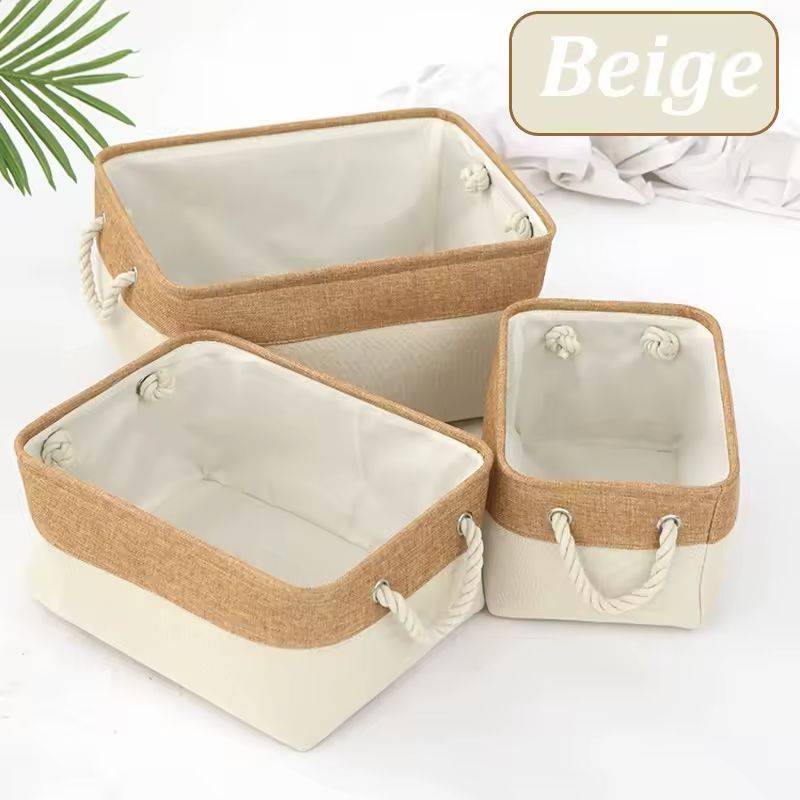 Beige linen storage basket with handles for organizing clothes, towels and accessories.