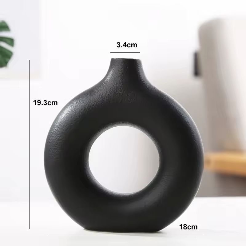 Dimensions of the medium black  Maison Donut ceramic vase measuring 19.3 cm high and 18 cm wide.