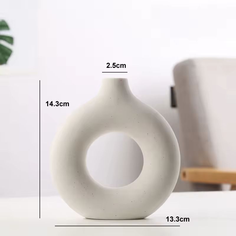 Dimensions of the mini white Maison Donut ceramic vase measuring 14.3 cm high and 13.3 cm wide.