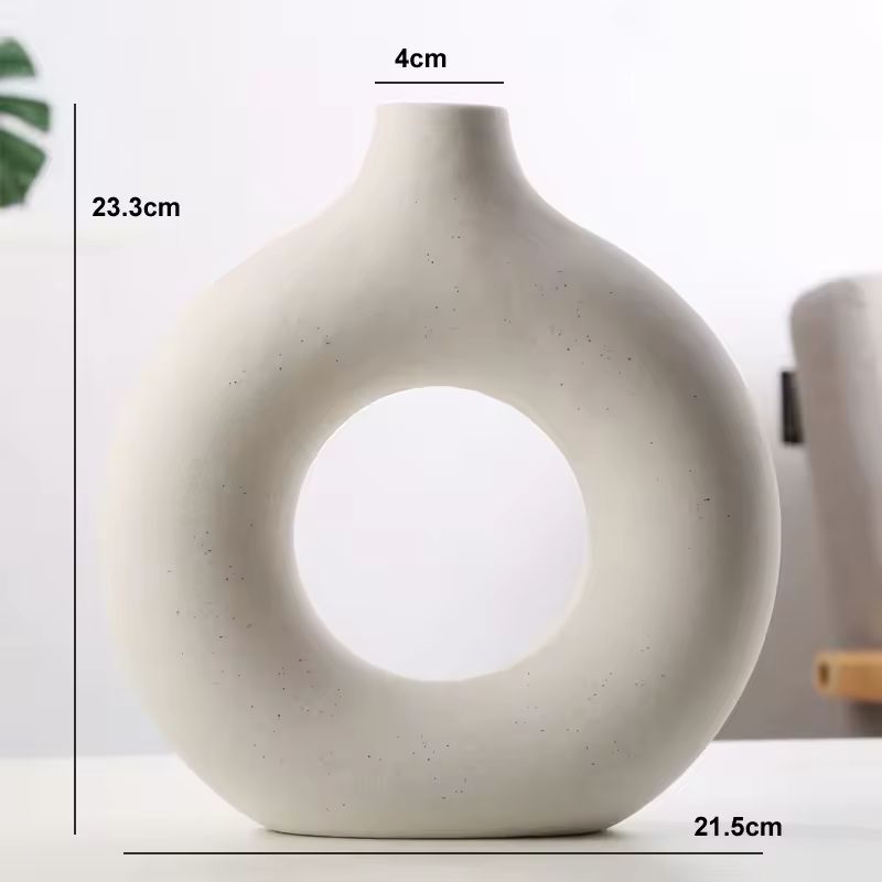Dimensions of the white Maison Donut ceramic vase measuring 23.3 cm high and 21.5 cm wide.