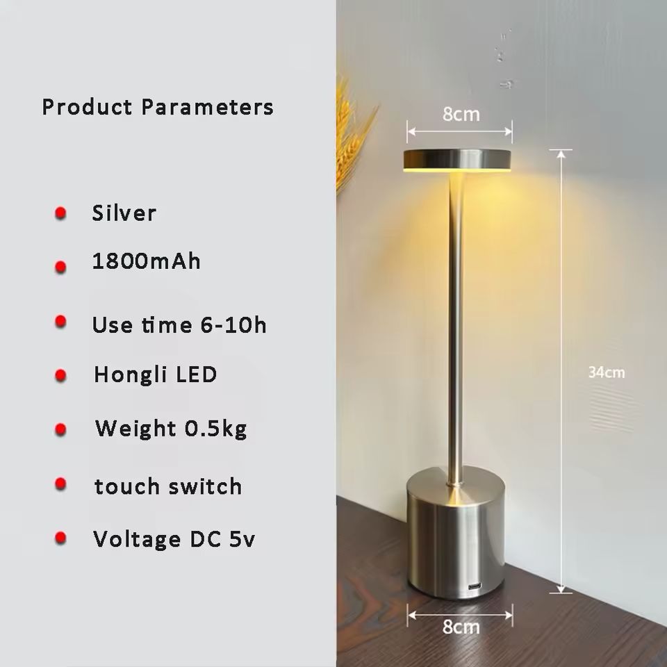 Silver cordless LED table lamp with touch control, rechargeable battery, warm light and modern minimalist design.